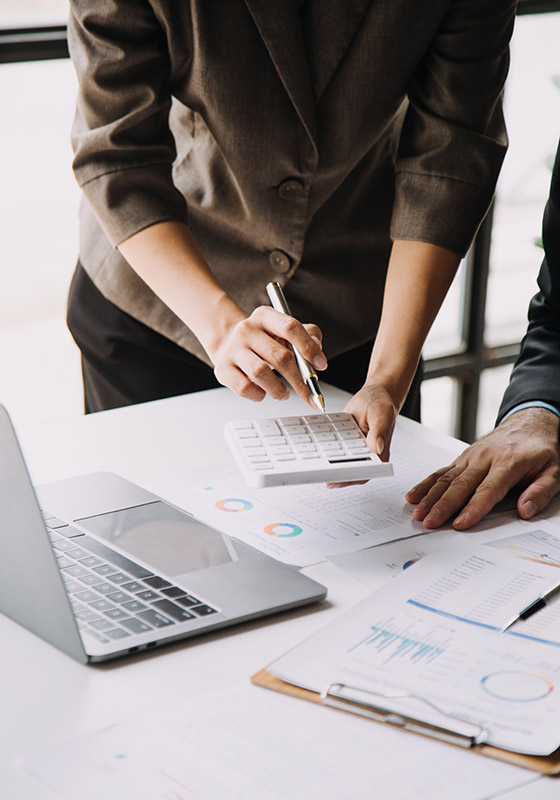 Financial analysts analyze business financial reports on a digit
