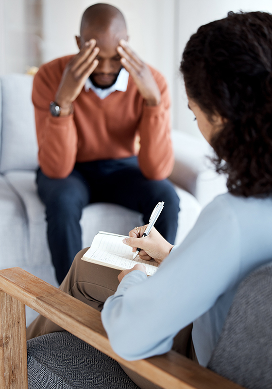 Woman psychologist writing, black man in therapy with mental hea